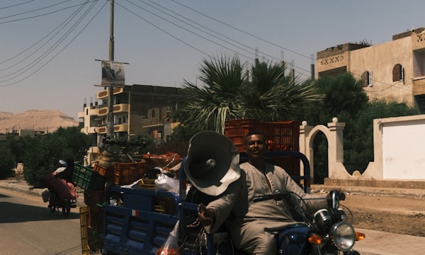 Cargo motorcycle loaded with goods on the road
