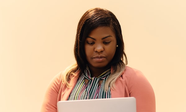 Woman browsing digital files on her laptop