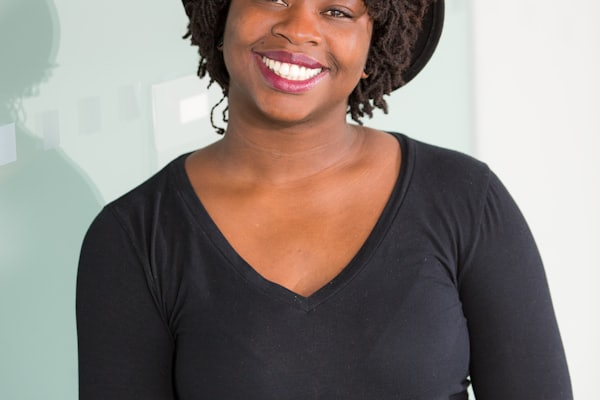 Young woman smiling as she starts her first online store